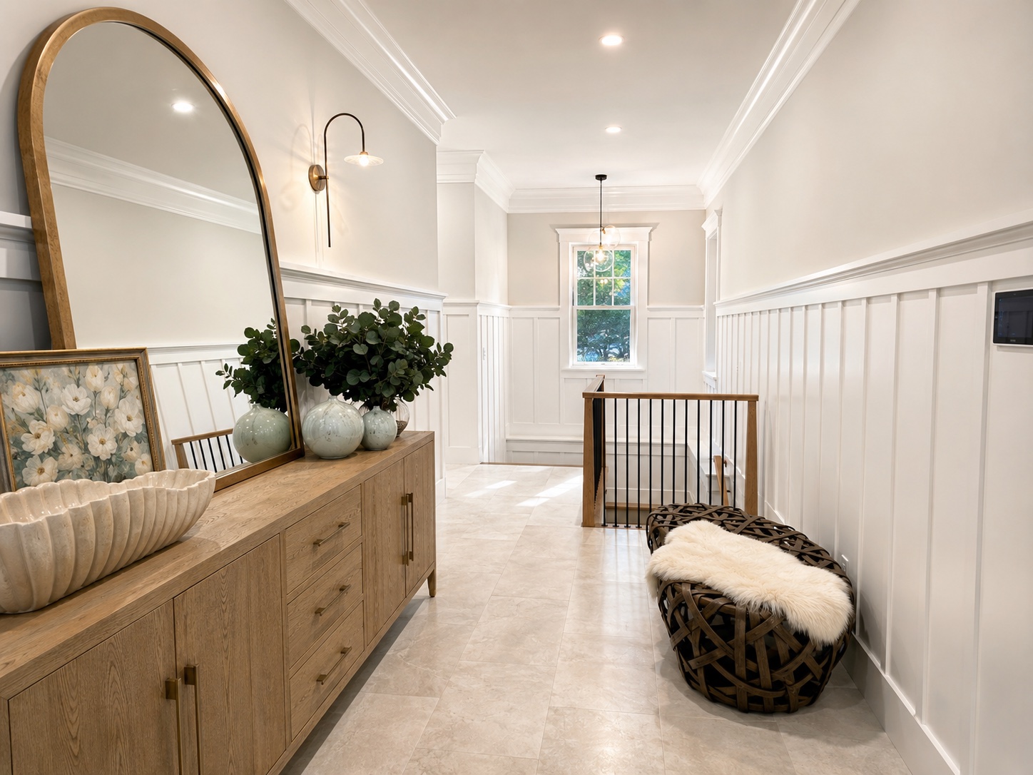 Interior hallway painting with white wainscoting, crown molding, warm neutral walls, and clean trim details